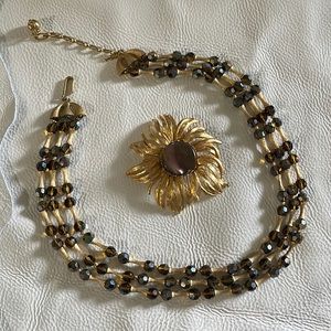 Vintage - 2pc set in gold toned “bamboo” with blueish and brown crystals/stone